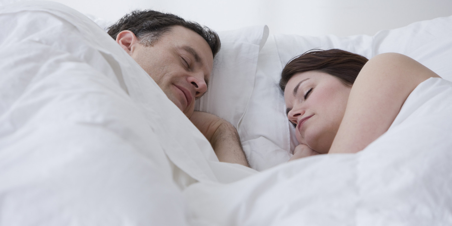 Couple sleeping in bed